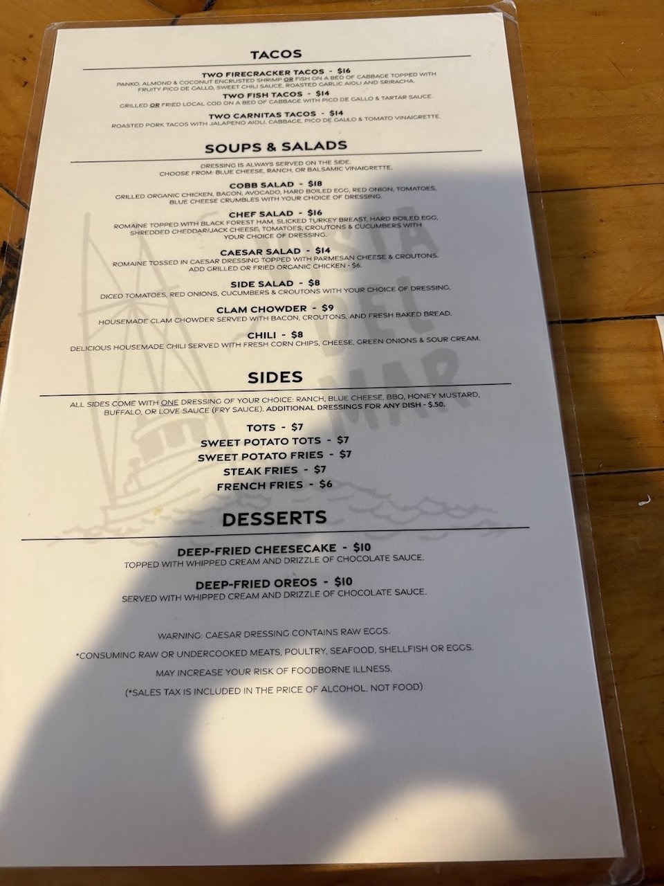 Printed menu with bar food sections.